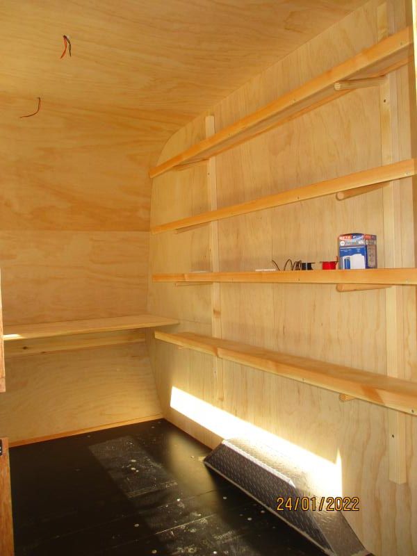 The rear wall carries the shelf.