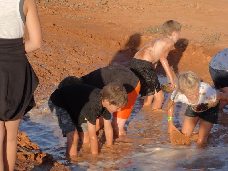 Outback fun - the thongs race. The winner is the one with two thongs on their feet in working condition.
