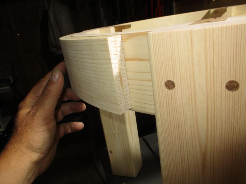 The drawer front is also laminated from wood strips at a larger radius