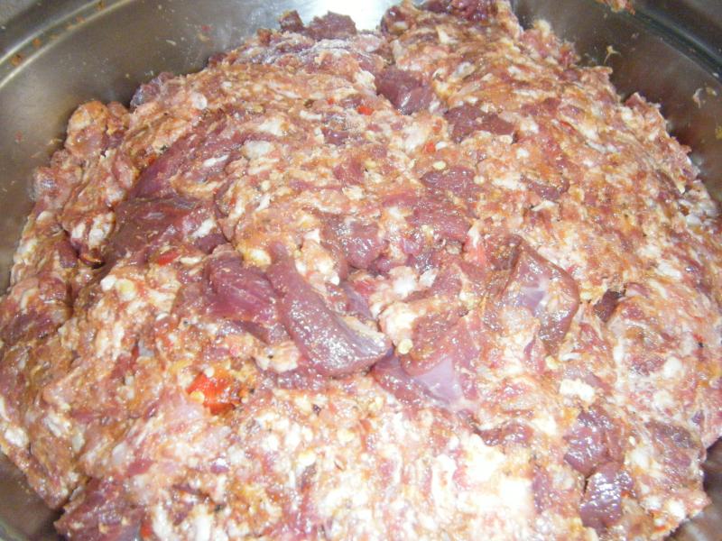 The spices are mixed and knead into the sausage meat